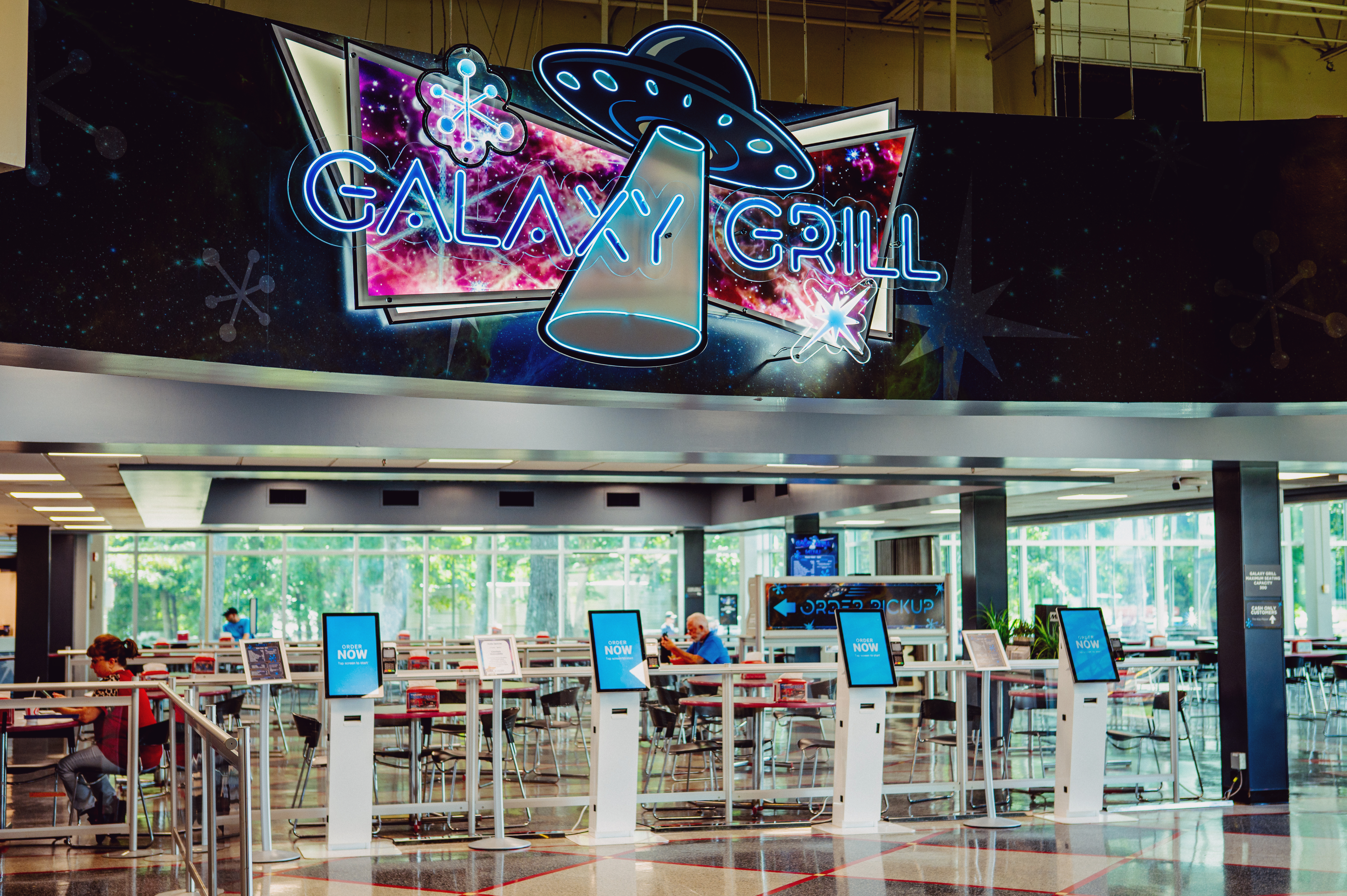 Galaxy Grill dining area with self-order kiosks